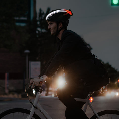 NightBlazr illuminated on helmet and with packaging