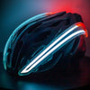 3/4 view of NightBlazr attached to cycle helmet turned on, showing red and white electroluminescent light blades