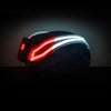 3/4 view of NightBlazr attached to cycle helmet turned on, showing red and white electroluminescent light blades