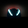 Front view of NightBlazr attached to cycle helmet turned on, showing red and white electroluminescent light blades
